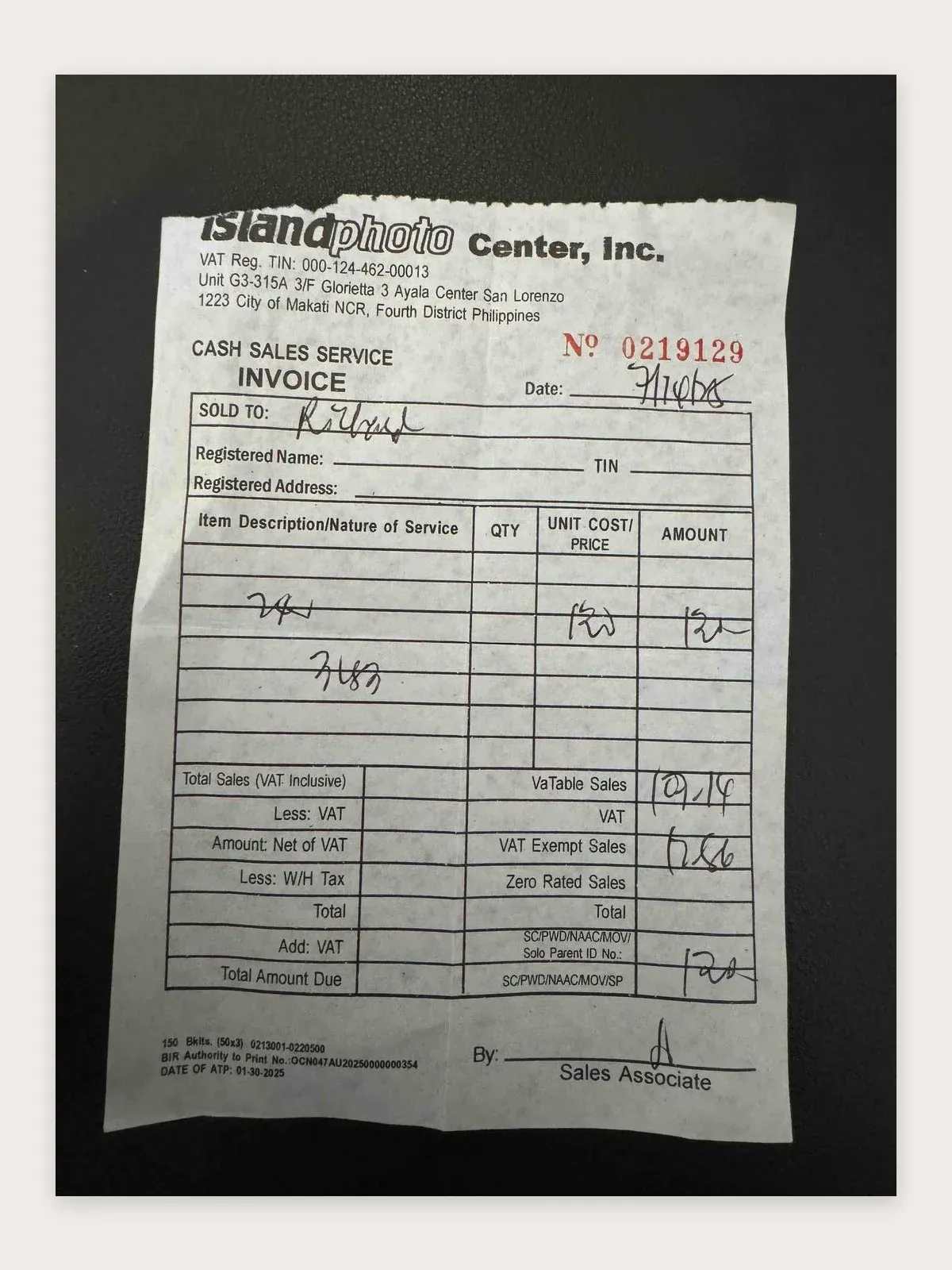Handwritten cash sales invoice from Island Photo Center in Makati, Philippines